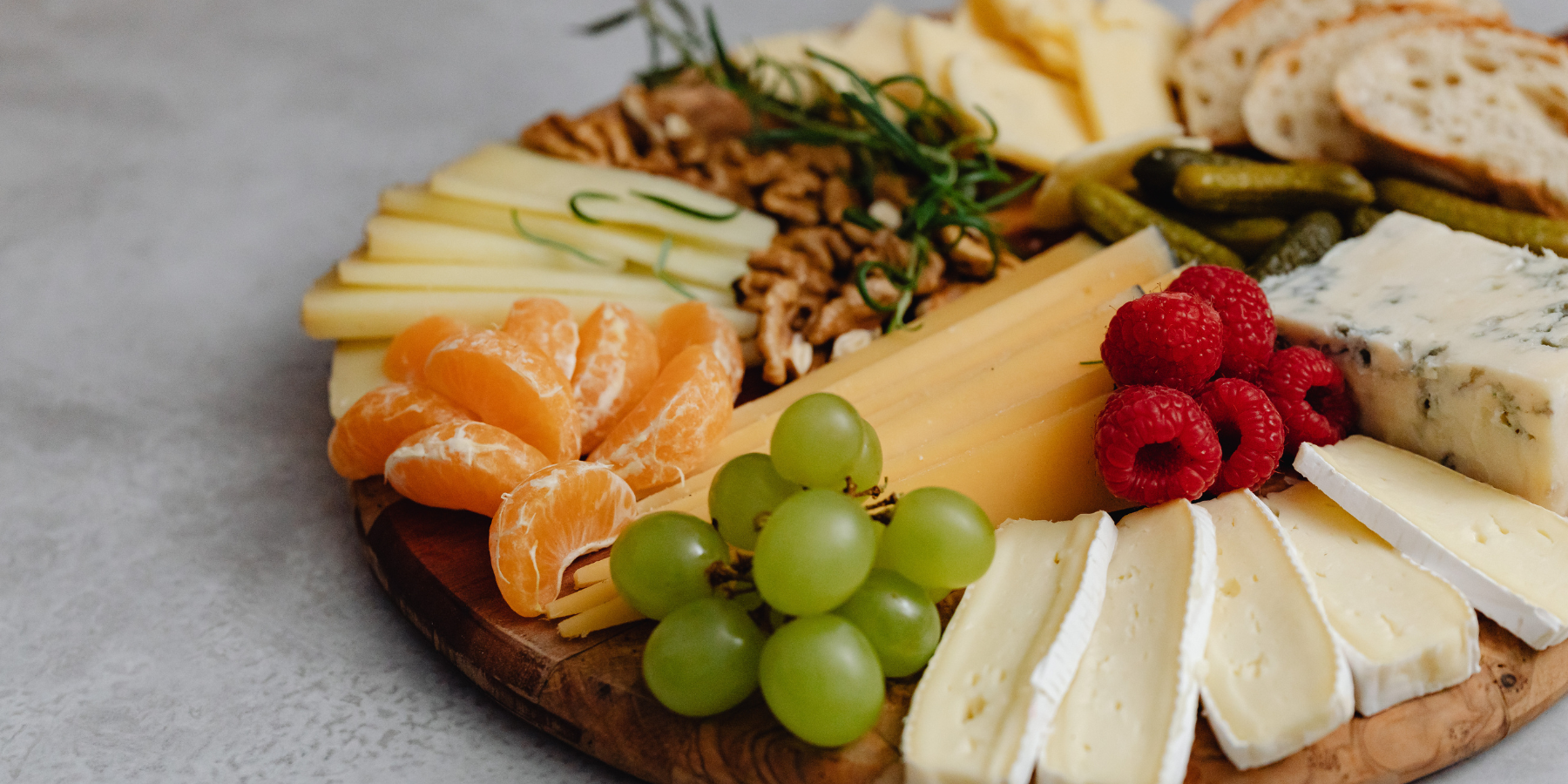 Charcuterie board with cheese fruit and bread